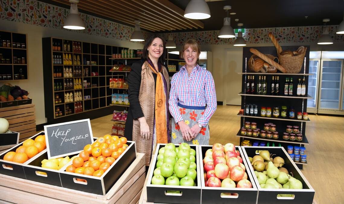 SHOPPING: Mercy Health chief Linda Mellors and grocer Lesley Sapsead in the home's grocery store.