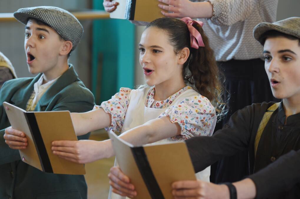 SING: Joe Appleton (Beagle), Chloe Warmington (Minnie) and Cooper Guinea (Jack) in the final dress rehearsal of Battle of Boat. Picture: Kate Healy