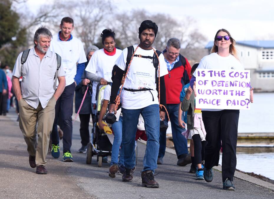 Tamil refugee Neil Para walking around Lake Wendouree in 2021 carrying 13.5kg to represent the mental load for himself, his wife and their three girls waiting 2691 days since their visas were revoked. He plans to repeat the walk this year carrying 20.25kg.