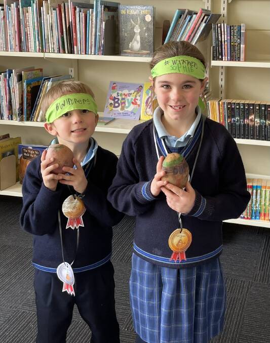 OLYMPIC SPIRIT: St Brendan's pupils Aiden and Sophie were keen competitors in the Dunnstown Potato Olympics.