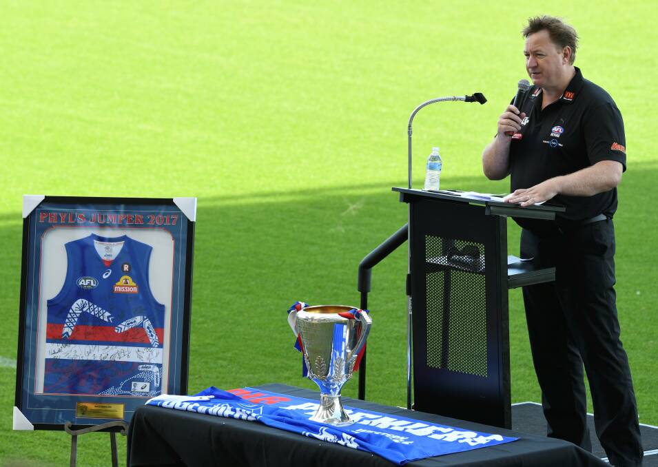 CUP: GWV Rebels talent manager Phil Partington shares memories of Shaun Kelly during the service. The 2016 Western Bulldogs premiership cup took centre stage.