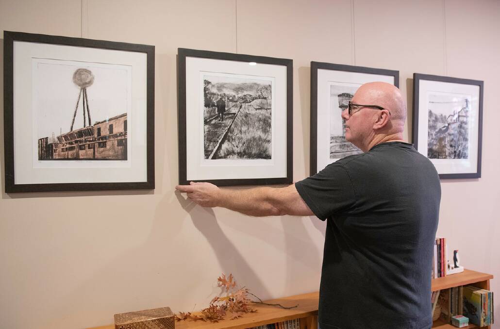 Cliff Adeney makes a final adjustment to the work that will be exhibited in his Armstrong St home for the 2019 SHAC ArtWalk. Picture: Ian Kemp