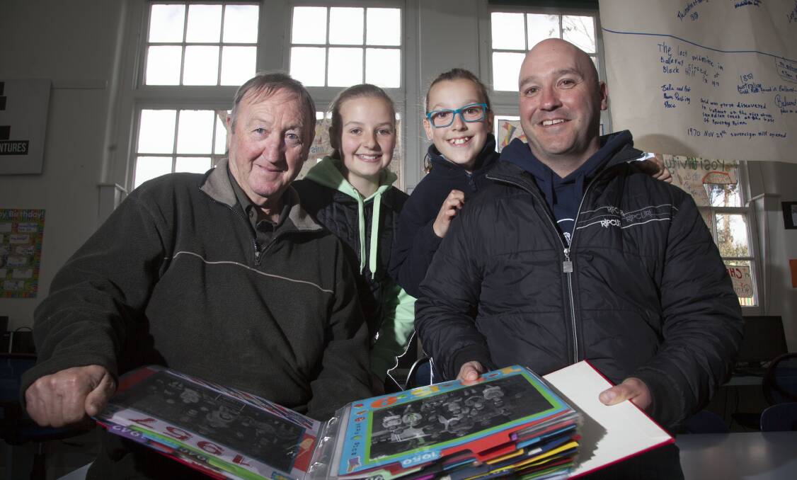 GENERATIONS: Colin, Sophie, Holly and Heath Boyd look through the old Bungaree photo album.  