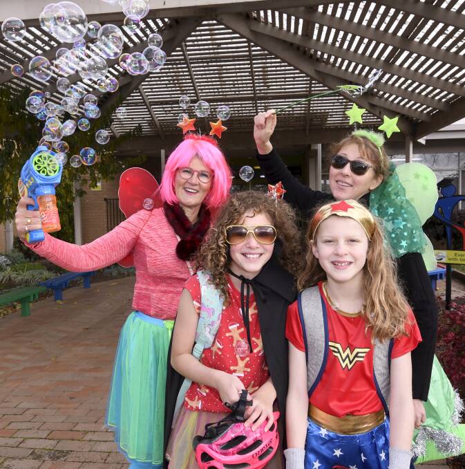 FAIRY FUN: Alfredton Primary School principal Laurel Donaldson and assistant principal Paula Sprague ramp up the fun with bubbles, balloons and grade six students Scarlett and Jessie. Picture: Lachlan Bence