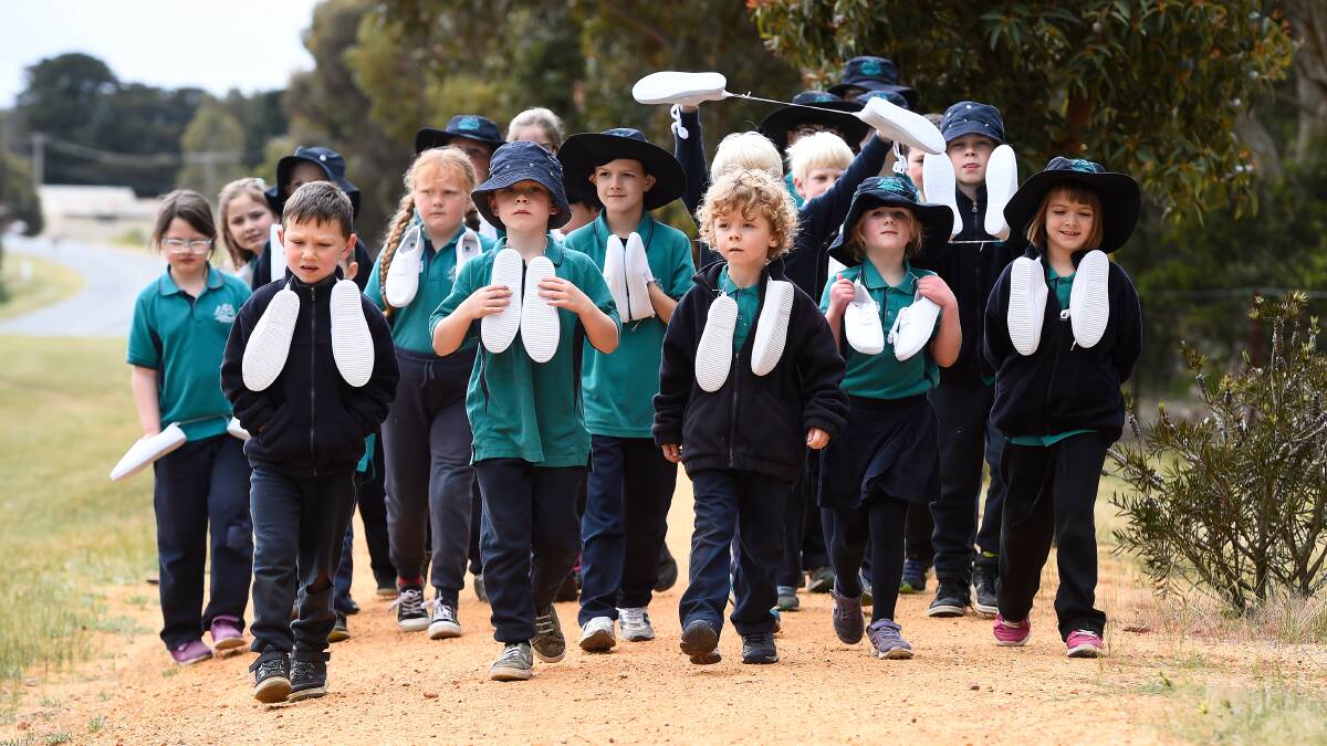 FEET: Cape Clear Primary pupils take a walk around school. Picture: Adam Trafford