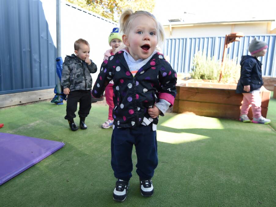 COMFORT: Adeline, 18 months, and her friends and carers at Ballarat North Early Learning Centre were comfy in the knowledge that wearing their tracky dacks helped raise money to buy distraction boxes for children in hospital. 