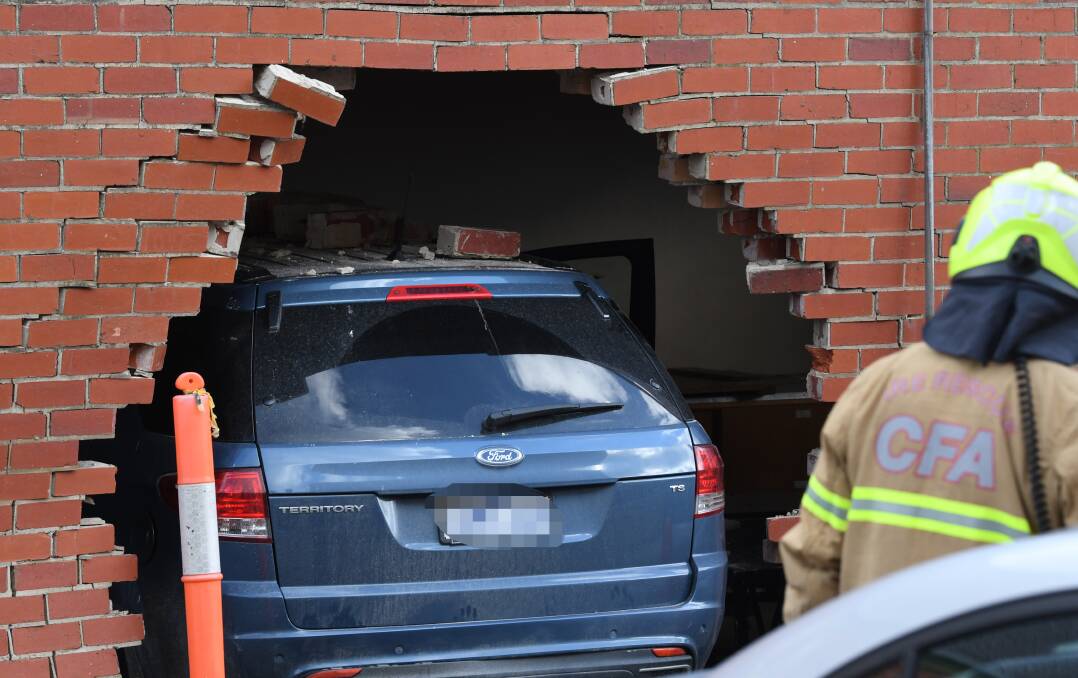 CRASH: CFA officers at the scene of an accident off Dawson Street in which a car drove through the wall of St Andrews Hall. Picture: Lachlan Bence
