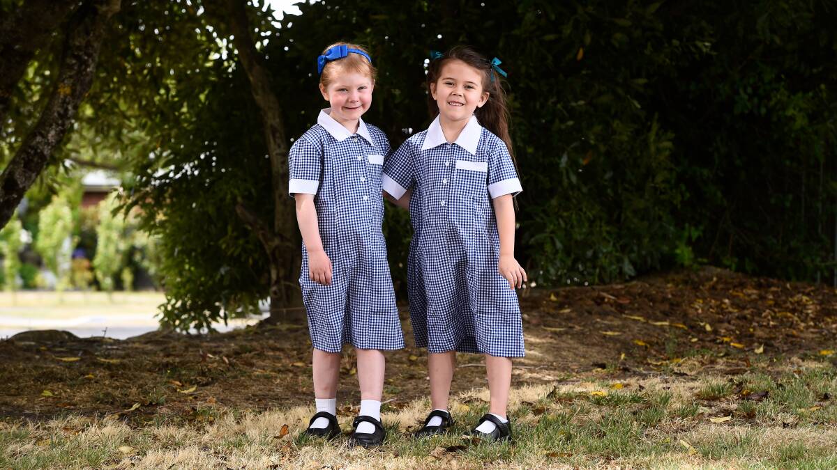 Friends Georgie and Harriet are excited about starting school at St Columba's Primary School. Picture by Adam Trafford