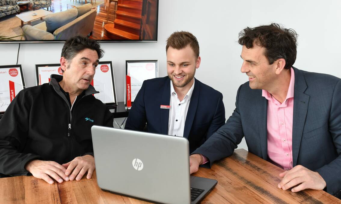 EMPLOYING: BGT field officer Ned Gregory, Hockingstuart Property Management head Lachlain Ramsay and director Tony Douglass look through a shortlist of applicants for their trainee property manager job. Picture: Lachlan Bence  