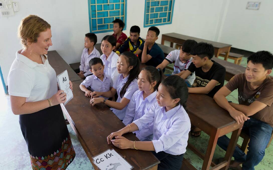 TEACHER: Bachelor of Education student Monique Fahey teaches a class of primary pupils at a rural school in Laos. The experience taught her the difference that education can make to people in third world countries.
