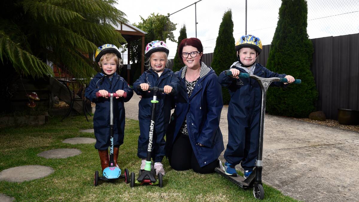 SCOOTER TIME: Award-winning Sebastopol family day care educator Melissa Dreger with her young charges Oscar, Stella and Ethan. Picture: Adam Trafford 