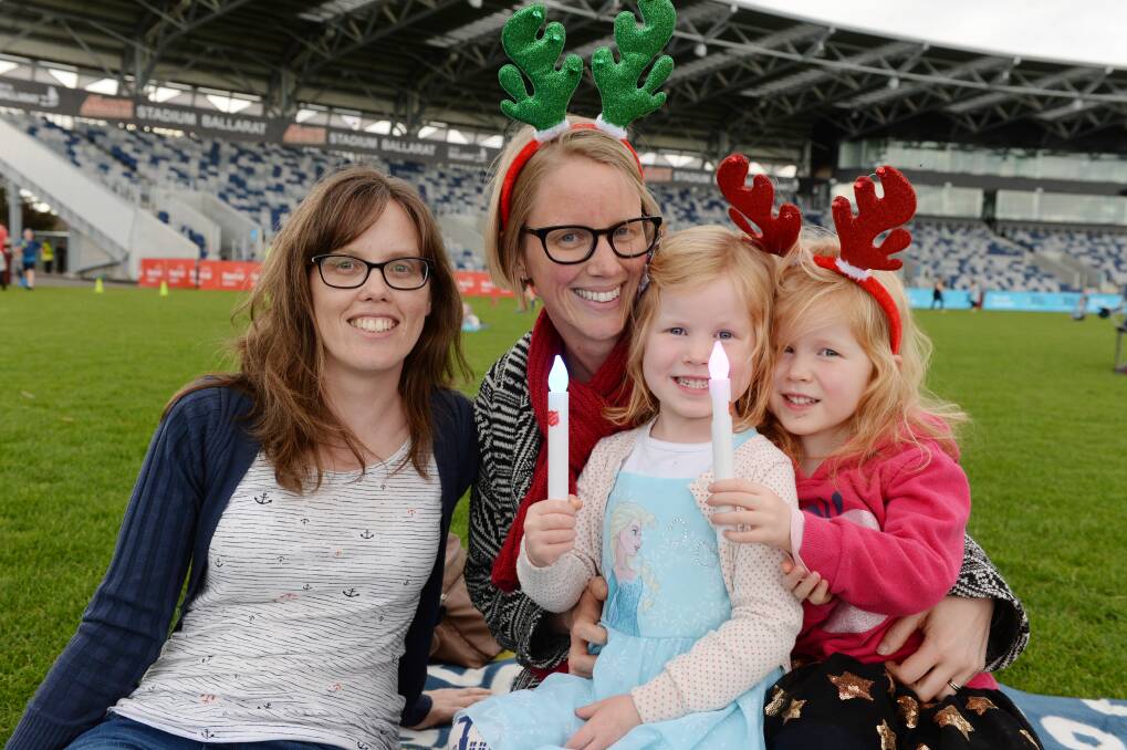 NO MORE CAROLS: Cheryl Roberts, Kylie Watson, Matilda Watson and Lily Watson enjoyed 2018 Carols by Candlelight at Mars Stadium but there will be no repeat performance this year after organisers cancelled the event. Picture: Kate Healy