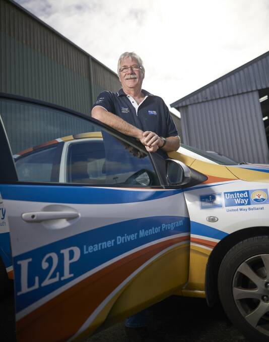 TEACHER: L2P driving mentor Gerard Nagle with one of the cars used to help learners under 21 years of age amass their required hours. Picture: Luka Kauzlaric