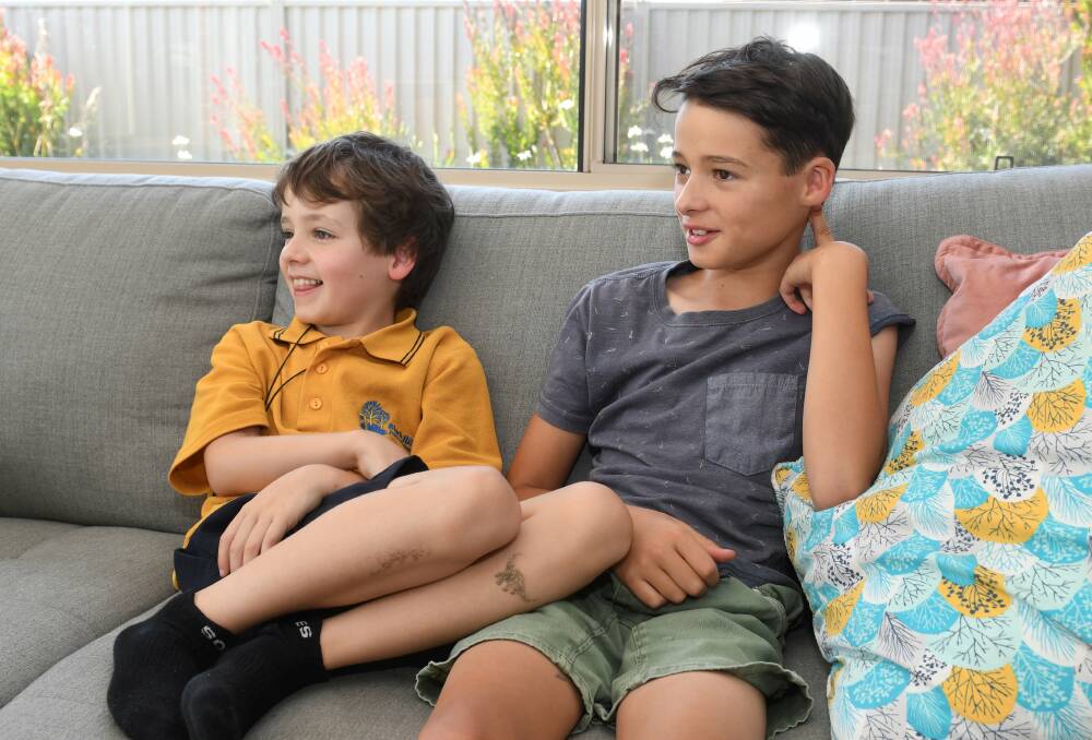 BOND: Jasper and Lewis relax after school at their Alfredton home this week. Pictures: Lachlan Bence