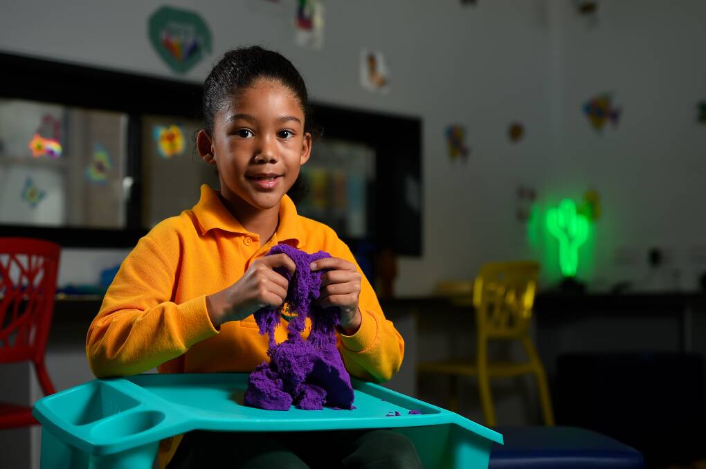 TACTILE: Harley, 7, plays with kinetic sand in Alfredton Primary School's new sensory room. Picture: Adam Trafford