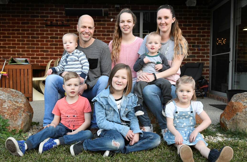IVF FAMILY: (clockwise) Dad Sam Harmer holding Felix, 2, Lily, 13, mum Kristin holding Banjo, 2, Violet, 3, Winter, 7, and Beau, 5. The five youngest family members were all born via IVF treatment. Picture: Lachlan Bence