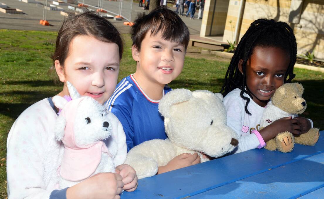 PICNIC: Ballarat Christian College grade two pupils Evelyn, Joseph and Lillian with their furry friends at the junior school's teddy bears picnic and pjyama day. Picture: Kate Healy