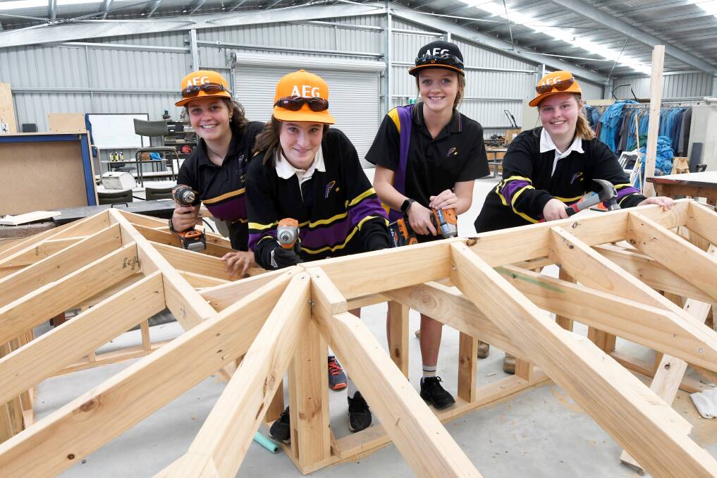 CONSTRUCTION: Phoenix P-12 Community College students Hannah, Chloe, Maya, and Taylor took part in a Women in Trades taster day at their school. Picture: Lachlan Bence 
