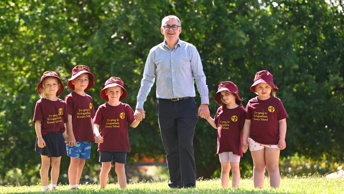 St Augustine's Primary principal Michael Heenan with some of the 2024 prep class, at an announcement last year that the school would receive $3.3 million funding for a new building. Picture by Adam Trafford