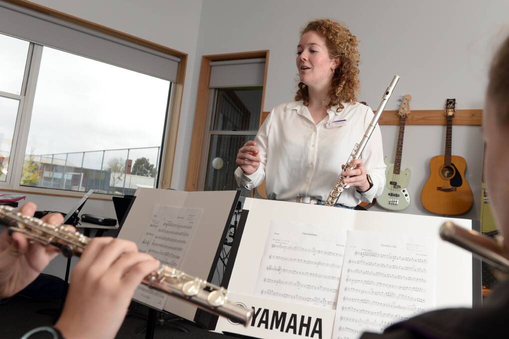 THANKFUL: Felicity Liston teaching flute at Phoenix P-12 Community College would not have been able to pursue her passion for music without the Smith Family. Picture: Kate Healy