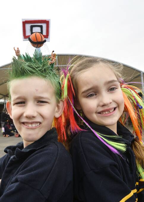 CREATIVE: Year two pupil Joseph and prep pupil Ava with their crazy hair at Ballarat Christian College to help raise money for drought-affected farmers. Picture: Dylan Burns