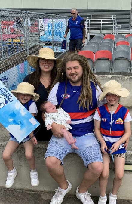 PASSIONATE: Rebecca and Aaron Zadow with daughters Elodie, 5, baby Oaklee and Payton, 7, at Western Bulldogs training. Picture: supplied