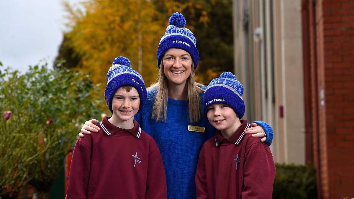 READY TO FREEZE: St Alipius Parish School principal Emily Clarke with students Lenny and Rafi don their Big Freeze beanies ahead of a 'dunk the principal' fundraiser to support FightMND. Picture: Adam Trafford