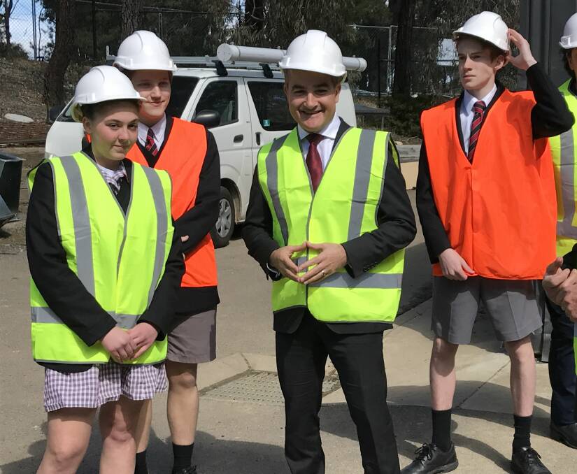 TOUR: Education minister James Merlino and Mount Clear College students visit the school's new technology hub, which is expected to open next term, before Mr Merlino announced a further $5.5 million of funding. 