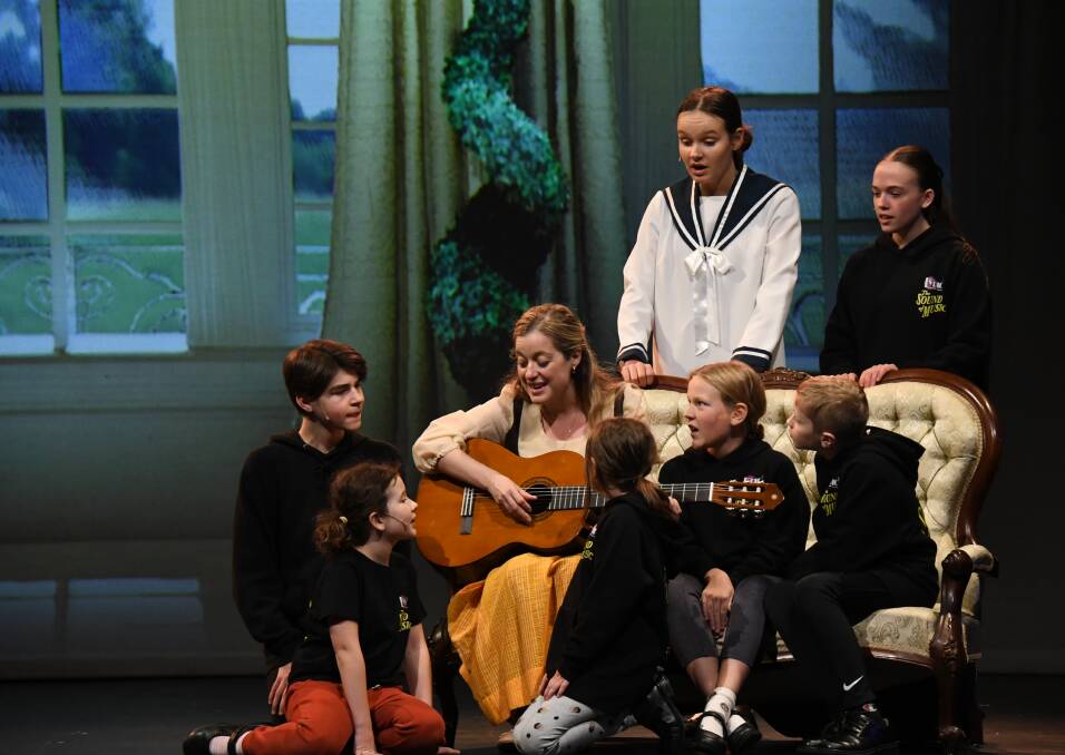 Jenna Featherstone as Maria Rainer with the Von Trapp children. Picture by Matthew Heenan