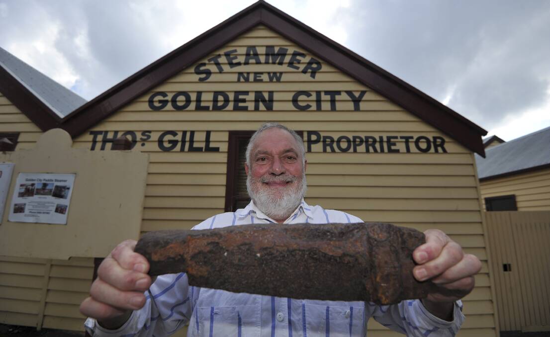 FOUND: Colin Holmes with a piece of firebox grate from the New Golden City steamer, which he found at the bottom of Lake Wendouree near Gill's Boatshed and recently rediscovered in his garden. Picture: Lachlan Bence