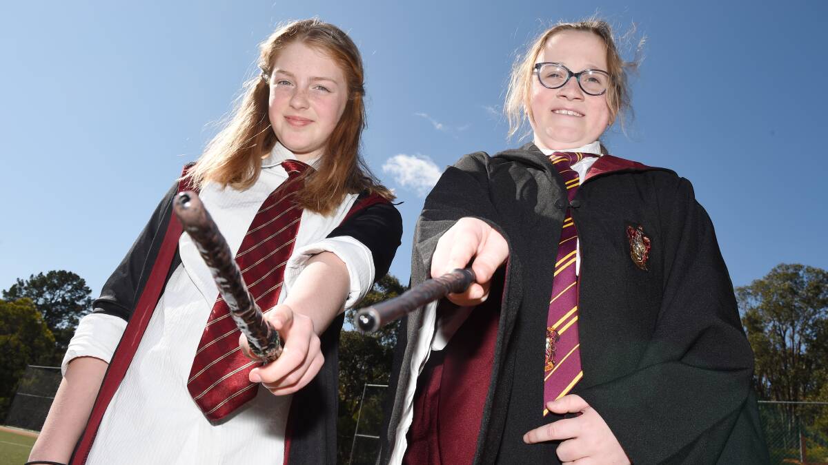 POTTERED: Tiana and Kaitlin twinned with Harry Potter costumes during Book Week. Picture: Kate Healy
