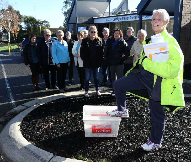 SUPPORT: Lyn McNeight the Cardigan Village postie has lost her contract with Australia Post after 20 years. Picture: Lachlan Bence