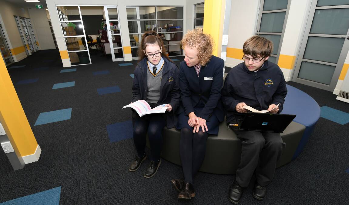 NEW SPACE: Mount Rowan Secondary College year 12 students Carly and James with principal Seona Murnane in an open learning space in the school's new STEAM building. Picture: Lachlan Bence