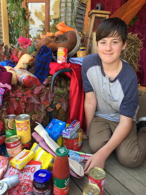 BOUNTY: Ballarat Steiner School pupil Murray Hassell with goods donated to Ballarat Soup Bus. 
