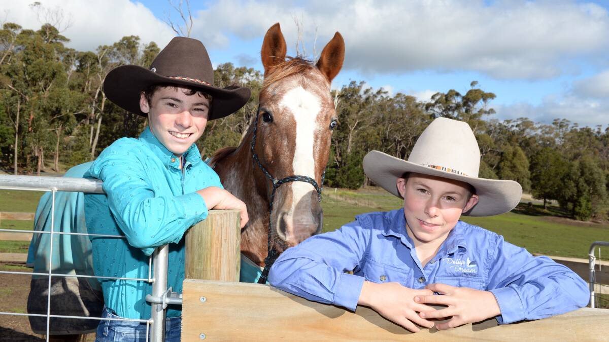 BRIGHT: The boys relax with Rango before heading to Emerald for the national titles next weekend. Picture: Kate Healy