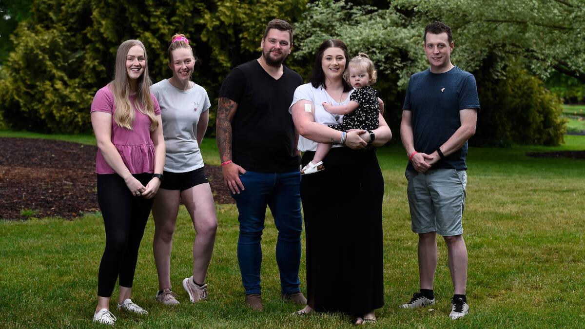SUPPORT: Chris Baxter, Grace Bailey and Billie Baxter (centre), with friends Georgina and Rowena Fuller (left) and Grace's brother Adam (right). Picture: Adam Trafford