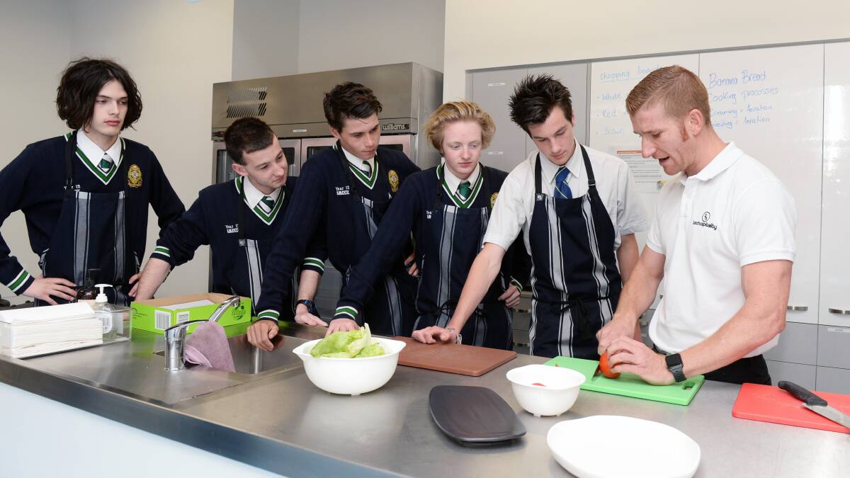 COOKING: St Patrick's College students with local chef LeRoy Hand in the newly-developed food technology centre last year. Picture: Kate Healy