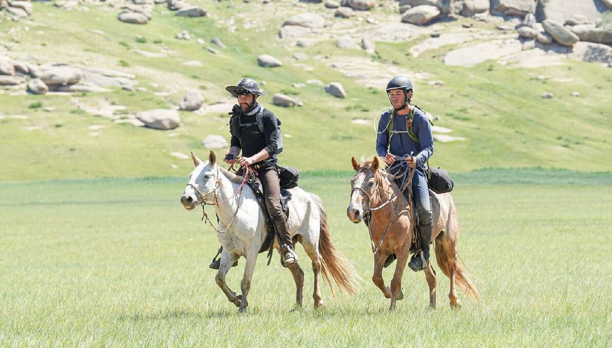 FINISH: Tyler Donaldson-Aitken (left) and Howard Bassingthwaighte ride to the finish line of the Mongol Derby. Picture: Mongol Derby/The Equestrianist