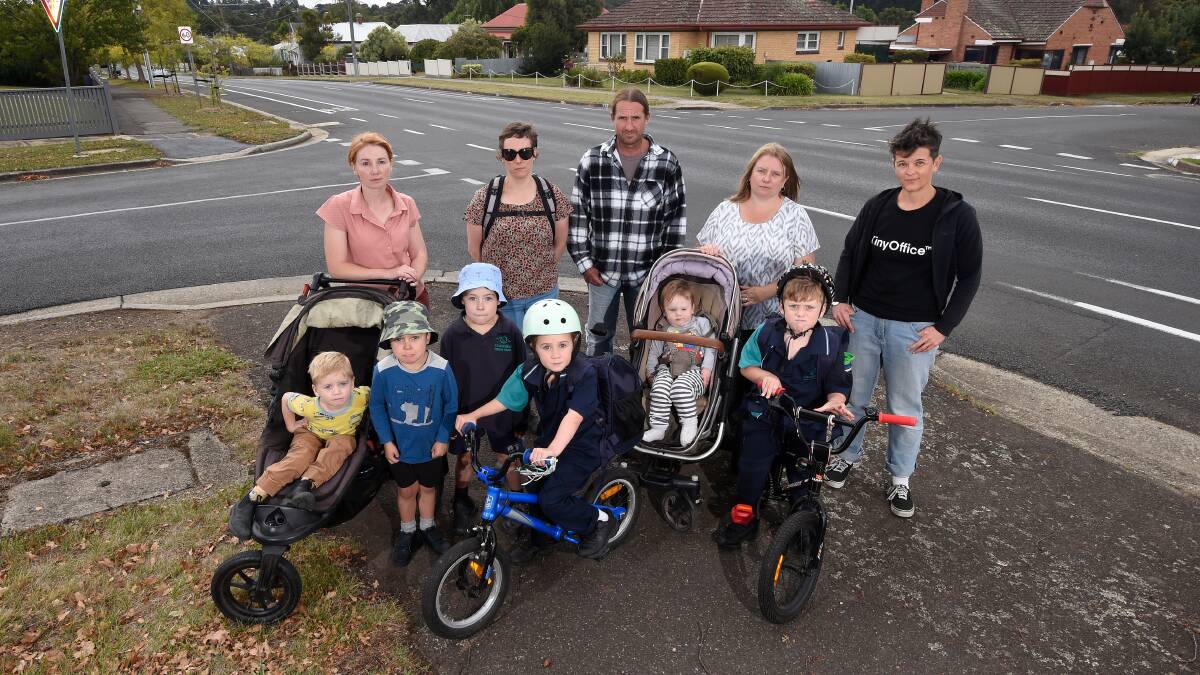 CONCERN: Sarah with Florence and Henry, Jane with Henry and Edwin, Mark and Louise with kids Ebony and Jimmy, and Jess Kelly at one of the busy intersections along Humffray Street. Picture: Adam Trafford. 