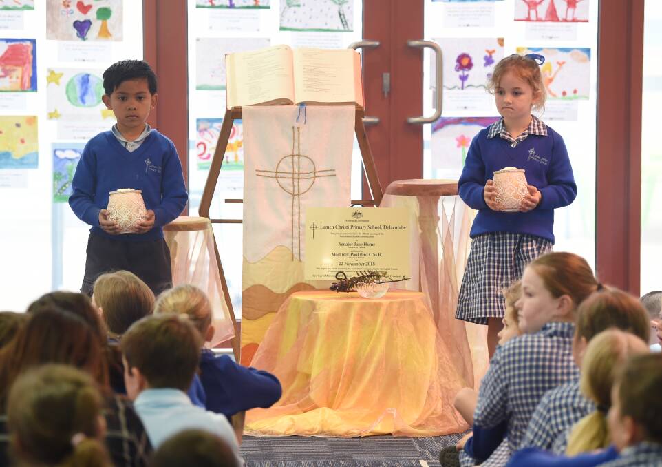 OPENING: Lumen Christi Primary School pupils Raph and Charlotte take part in the official opening of the school's newly refurbished learning space. Picture: Kate Healy
