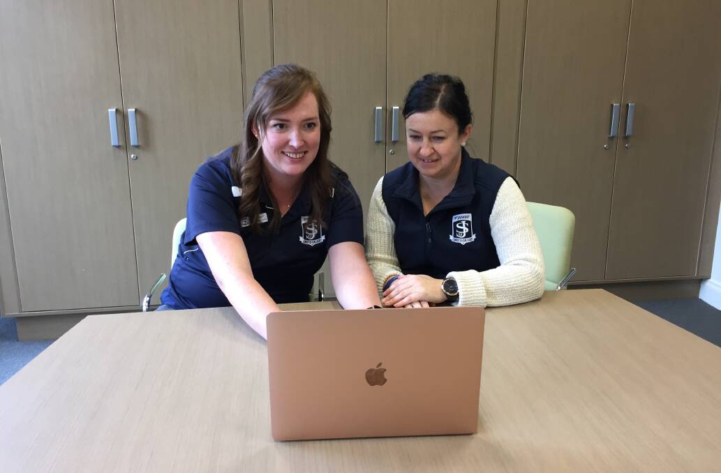 TEACHING DIFFERENTLY: St James staff members Rebecca Ryan and Alicia Sandford online with years five and six students. 