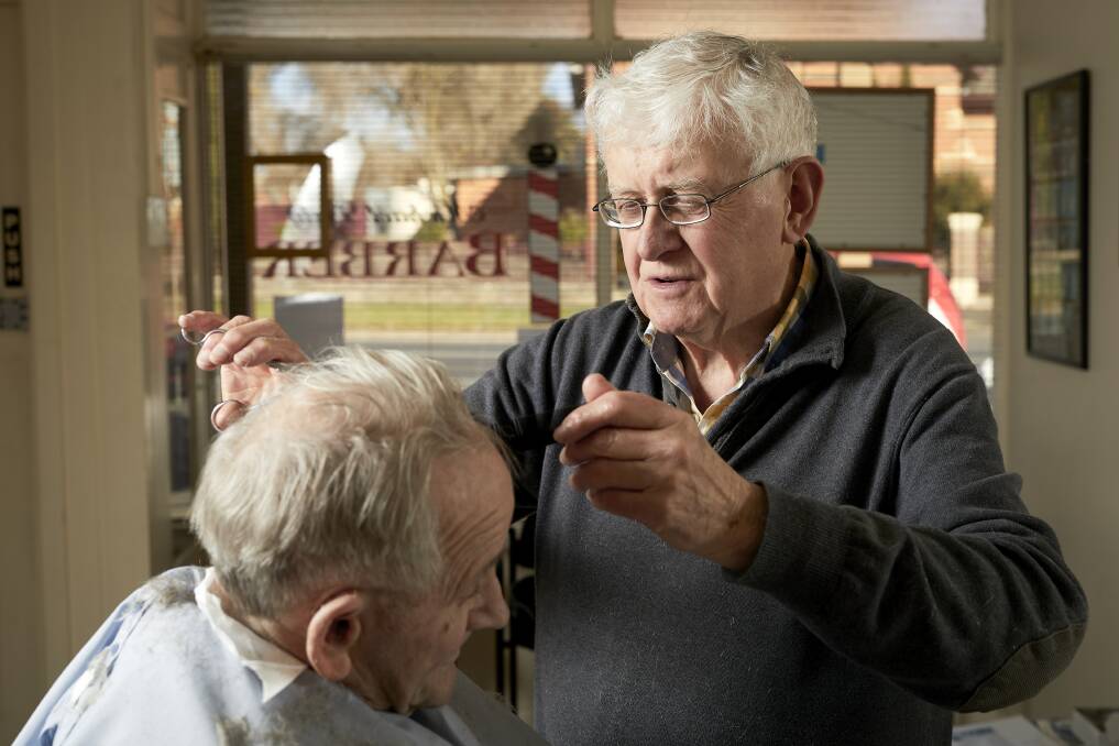 RETIRING: Soldiers Hill barber Michael Daly is hanging up his scissors next week after cutting the locks of local men for the past 61 years. Picture: Luka Kauzlaric