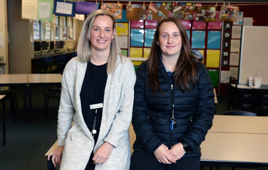 RETURN: Twins Katelyn and Jessica Sutton in the classroom at Creswick Primary School where they were once students. Picture: Kate Healy
