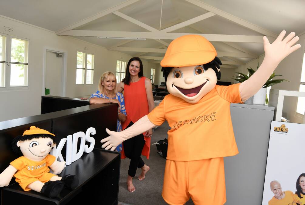 NEW DIGS: KIDS Foundation's Susie O'Neill and Janine Buesnel with SeeMore Safety in their new offices at Ballarat Airport. Picture: Lachlan Bence