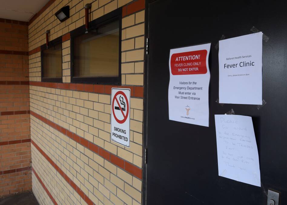 TESTING: Signs on the door of the coronavirus clinic at Ballarat Health Services. Picture: Lachlan Bence