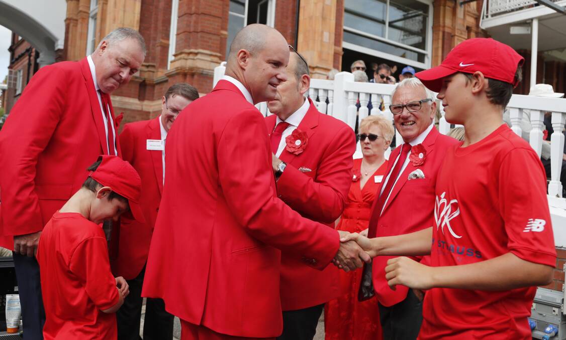 RED: Andrew Strauss surrounded by supporters of the Ruth Strauss Foundation, established to support patients with rare lung cancers and their families.
