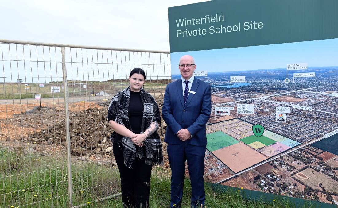 Future Winterfield North resident Emily Ord and Catholic Education Ballarat executive director Tom Sexton near the site of a new Catholic school to be built in Winter Valley.