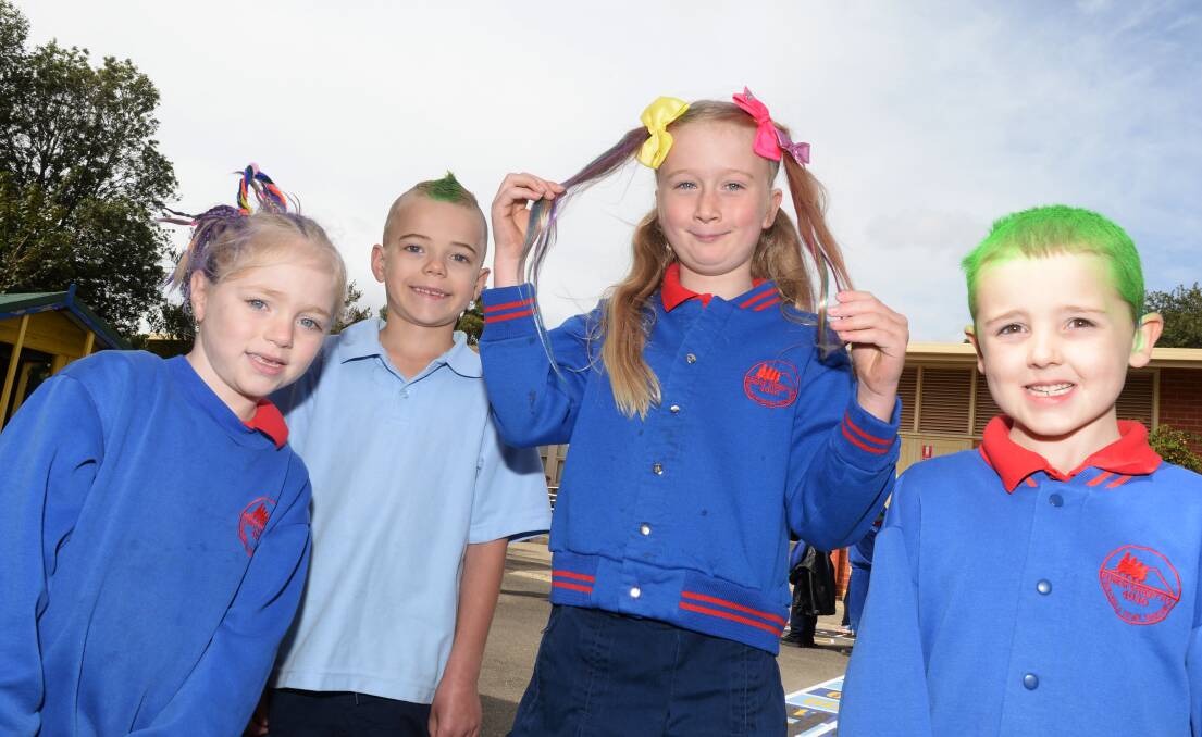 CRAZY HAIR: Forest Street Primary School pupils Savannah, Hunter, Paige and Dane show off their coloured hair for a good cause. Picture: Kate Healy