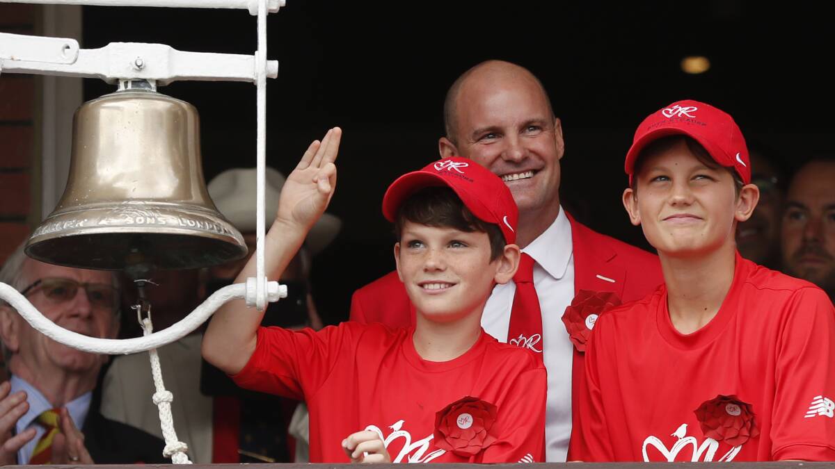 BELL: Luca and Sam Strauss get ready to ring the five-minute bell at Lord's, flanked by their father Andrew, in honour of their mother Ruth. 