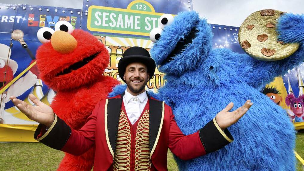 BIG TOP: Elmo and Cookie Monster pose with the ringmaster outside the Sesame Street Circus Spectacular.Picture: supplied